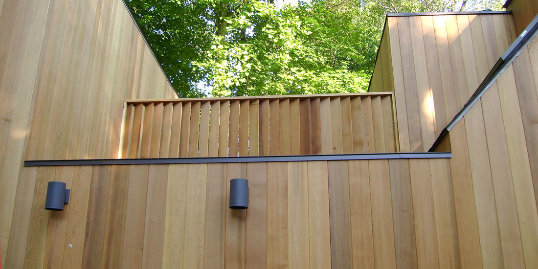1x6 T&G Clear Western Red Cedar Siding installed vertically - home in Pennsylvania